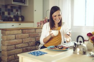Young woman having a great customer experience while registering a product with Photoregister